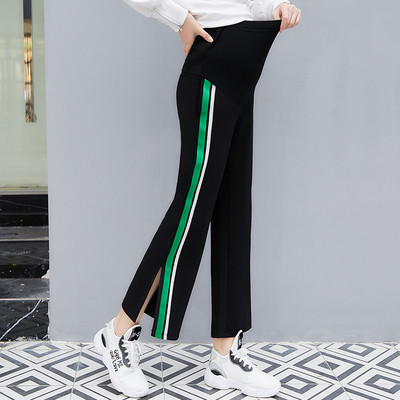 Μοντέρνα παντελόνια για έγκυες γυναίκες με πλευρική μπορντούρα σε δύο χρώματα