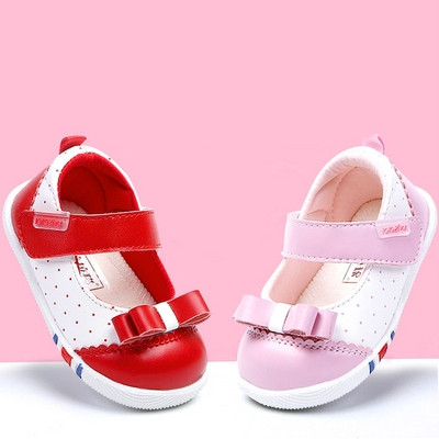 Modern baby shoes with ribbons and stickers in several colors