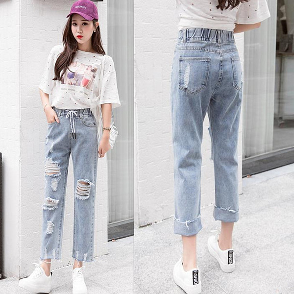 Blugi de dama moderni cu sireturi si motive rupte