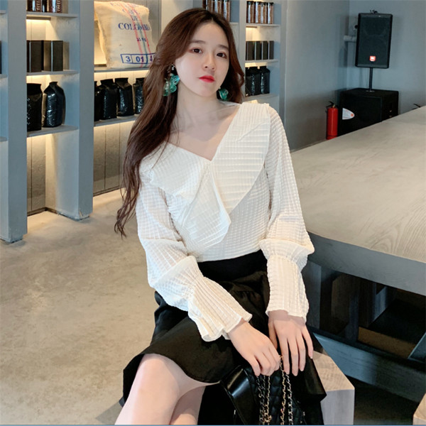 Γυναικεία κομψή μπλούζα σε μαύρο και άσπρο χρώμα