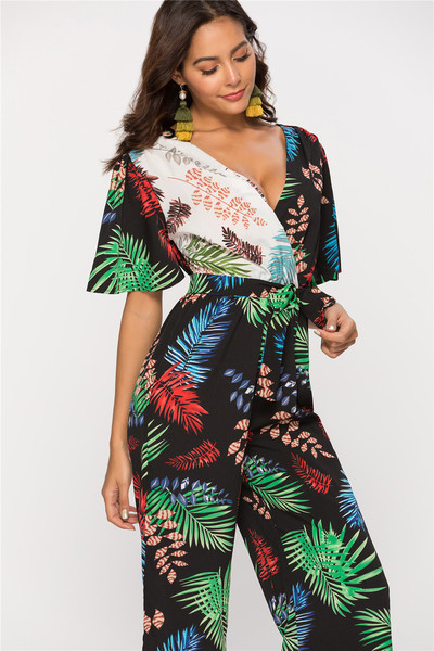 Modern női overál V-nyakú és virágmotívumokkal