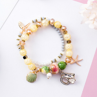 Μοντέρνο γυναικείο βραχιόλι με μενταγιόν και χάντρες