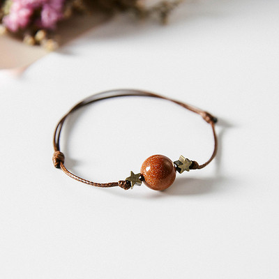 Női textil karkötő gyöngyökkel