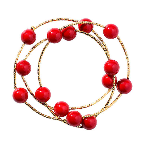 Modern női karkötő piros gyöngyökkel
