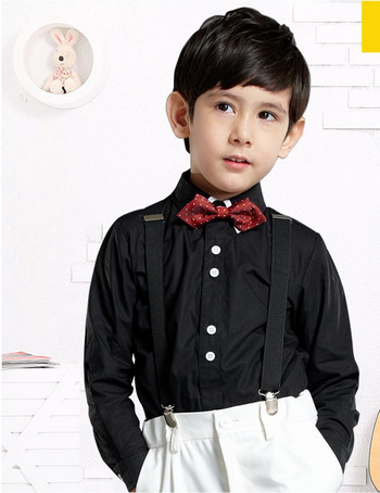 Κομψό παιδικό πουκάμισο για αγόρια σε μαύρο χρώμα με λευκά κουμπιά