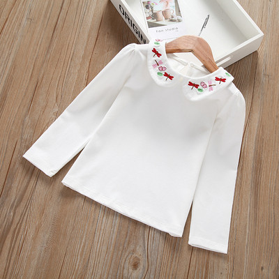 Friss gyerekblúz lányoknak fehér színben, hímzéssel és hosszú ujjal