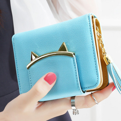 Női kis pénztárca bojt kiegészítővel több színben