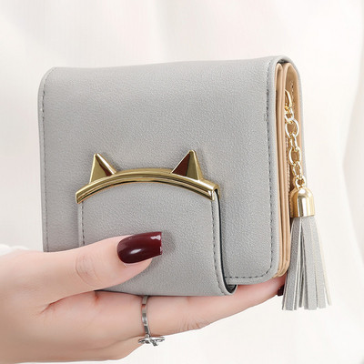 Női kis pénztárca bojt kiegészítővel több színben