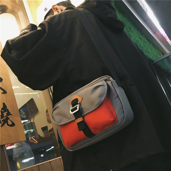 Férfi hétköznapi táska több színben, elülső zsebbel