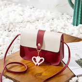 Új modell női táska medállal és fém csattal több színben