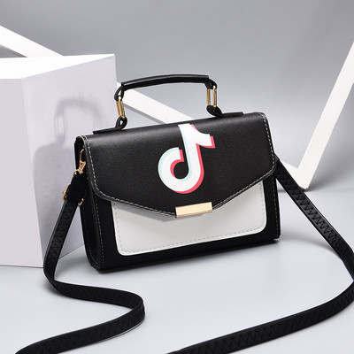 Modern női táska fém fogantyúval, öko bőrből