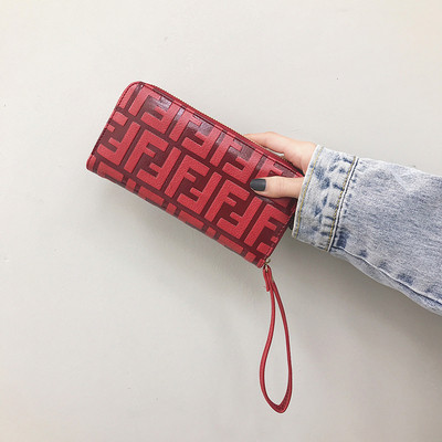 Modern női pénztárca cipzárral és rövid fogantyúval