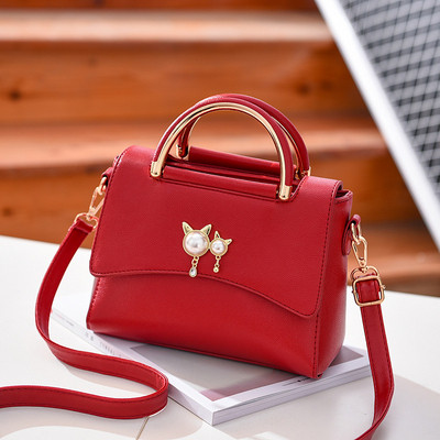 Μοντέρνα γυναικεία  τσάντα με μεταλλική  λαβή σε διάφορα χρώματα