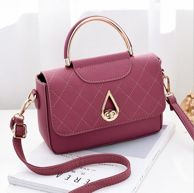 Stílusos női táska fém fogantyúval több színben