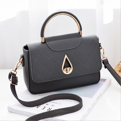 Stílusos női táska fém fogantyúval több színben