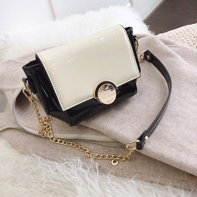 Modern női táska fém rögzítéssel, különböző színekben