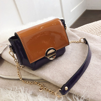 Modern női táska fém rögzítéssel, különböző színekben