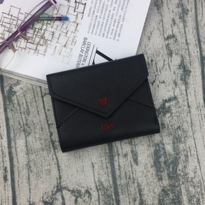 Κομψό γυναικείο μίνι πορτοφόλι με κεντήματα