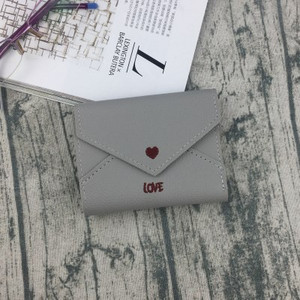 Κομψό γυναικείο μίνι πορτοφόλι με κεντήματα