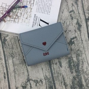 Κομψό γυναικείο μίνι πορτοφόλι με κεντήματα