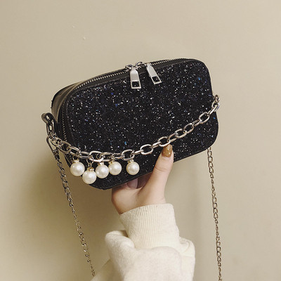 Aktuális női táska gyöngyökkel és fém fogantyúval három színben