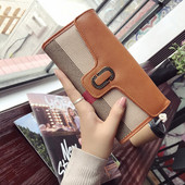 Stílusos női pénztárca fém rögzítéssel