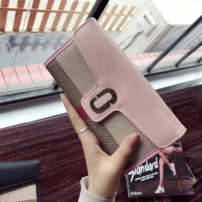 Stílusos női pénztárca fém rögzítéssel