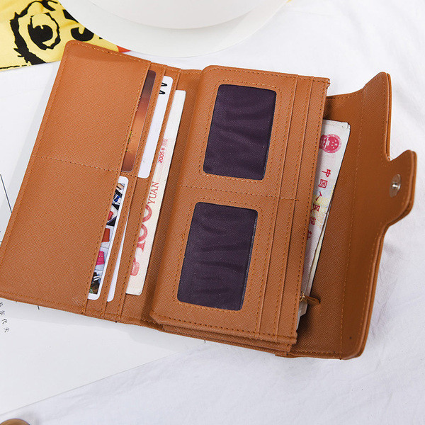 Stílusos női pénztárca fém rögzítéssel