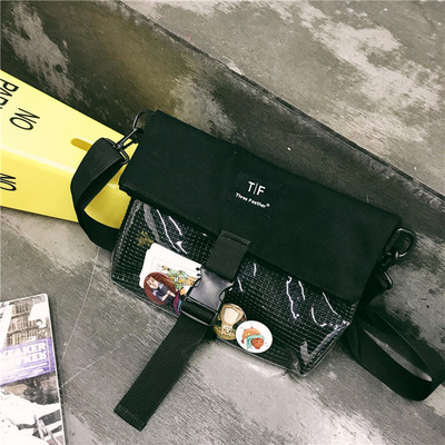 Modern táska elülső zsebbel, négy színben