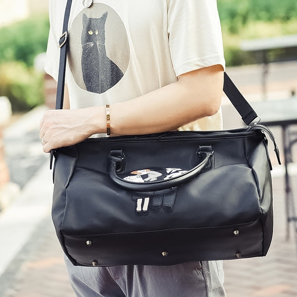 Alkalmi táska fekete színben, rátéttel