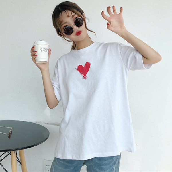 Fekete-fehér rátéttel ellátott női póló