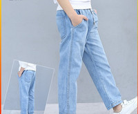 Kék színű, lezser gyerekfarmer, széles fűzős modellel