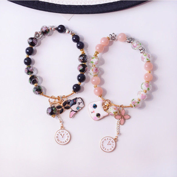 Γυναικείο βραχιόλι με χάντρες και μενταγιόν σε δύο χρώματα
