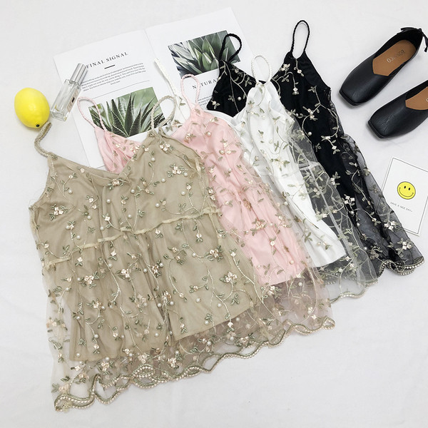 Virágos hímzéssel ellátott női felső, több színben