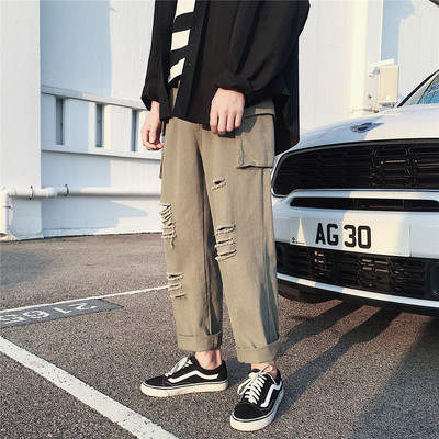 Lezser férfi nadrág, zsebekkel, szakadt motívumokkal