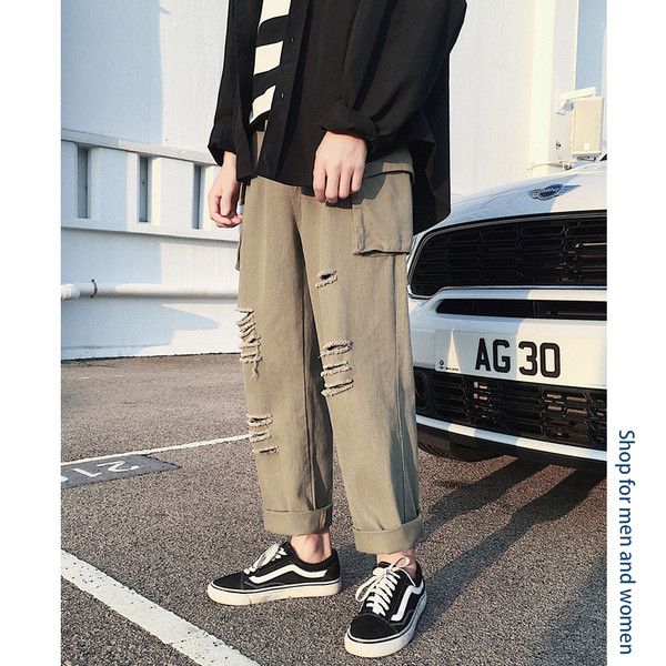 Lezser férfi nadrág, zsebekkel, szakadt motívumokkal