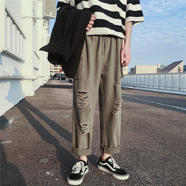 Lezser férfi nadrág, zsebekkel, szakadt motívumokkal