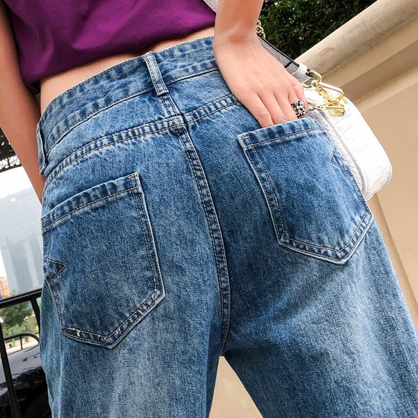 Női farmer kék színben, szakadt motívumokkal 7/8 modell