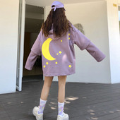 Modern női pulóver nyakkendővel és fekete és lila mintával