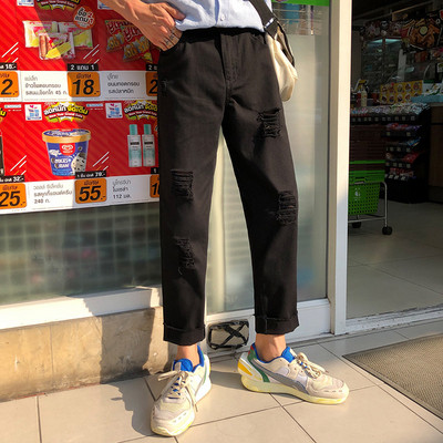 Divatos férfi nadrág szakadt motívumokkal, három színben széles modellben