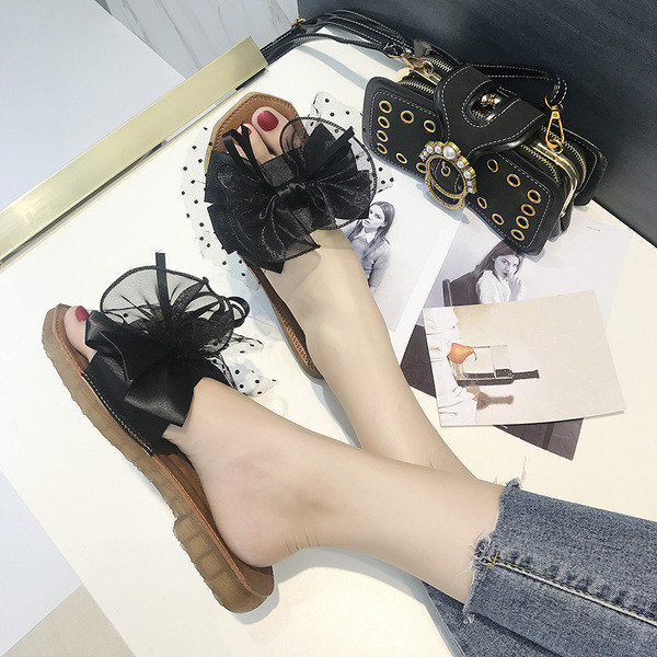 Modern női papucs fekete és zöld színű szalaggal