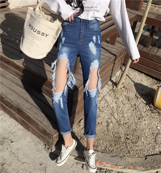 ÚJ Modern női farmer kék színben, szakadt motívumokkal