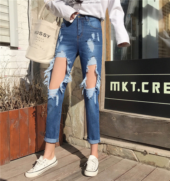 ÚJ Modern női farmer kék színben, szakadt motívumokkal