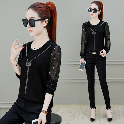 Elegáns női blúz fekete színben, átlátszó ujjakkal