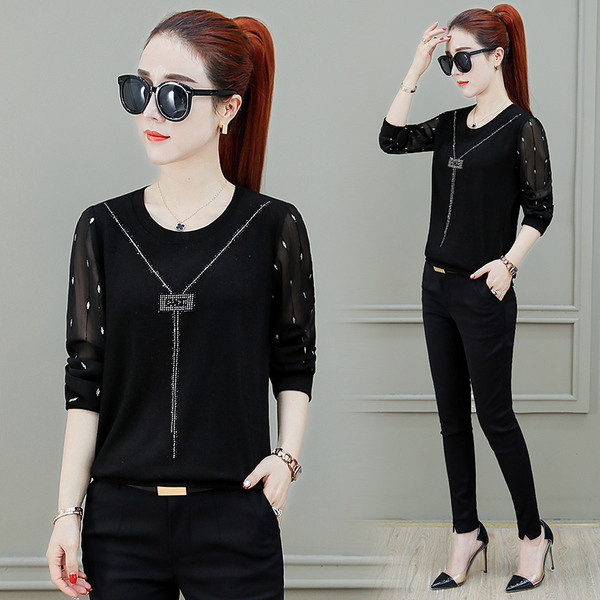 Elegáns női blúz fekete színben, átlátszó ujjakkal