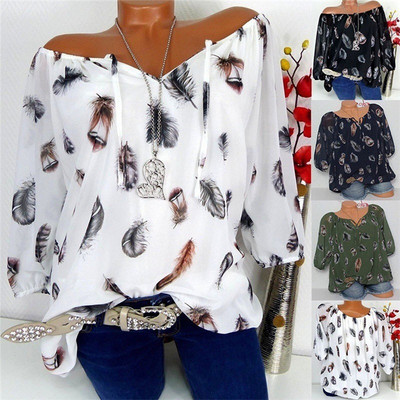 New women`s blouse in white, green, black and pink with feather print