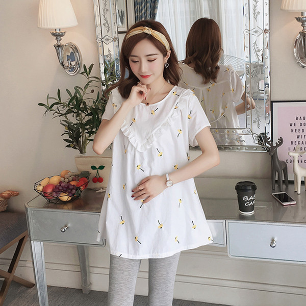 Стилна блуза за бременни жени в бял цвят с флорални мотиви