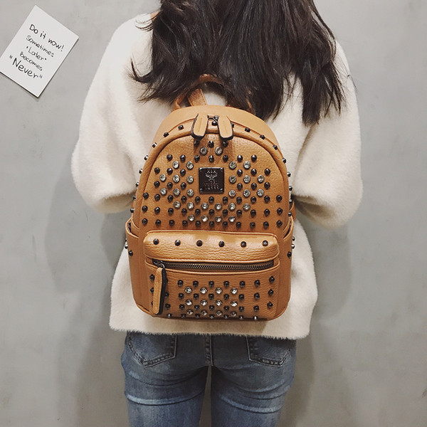 Дамска раница от еко кожа с метална декорация