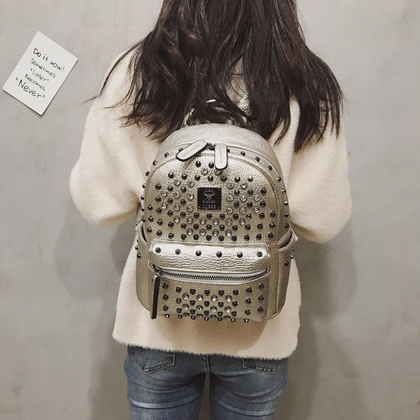 Дамска раница от еко кожа с метална декорация