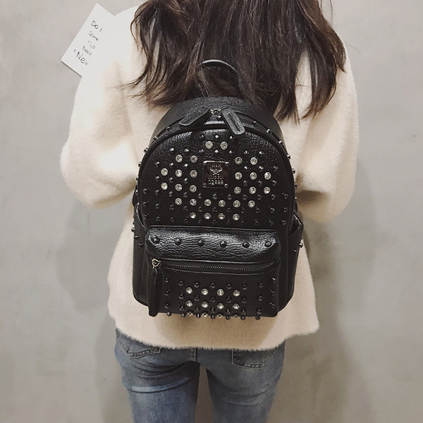 Дамска раница от еко кожа с метална декорация